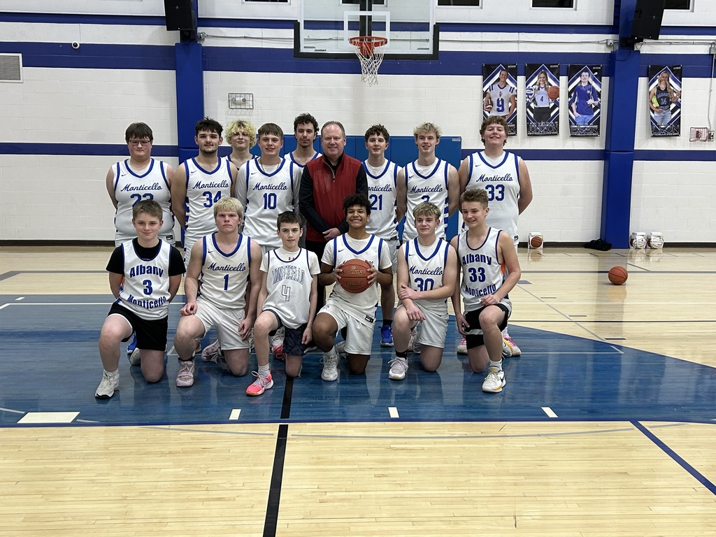 High School Boys Basketball Team with Badgers Coach