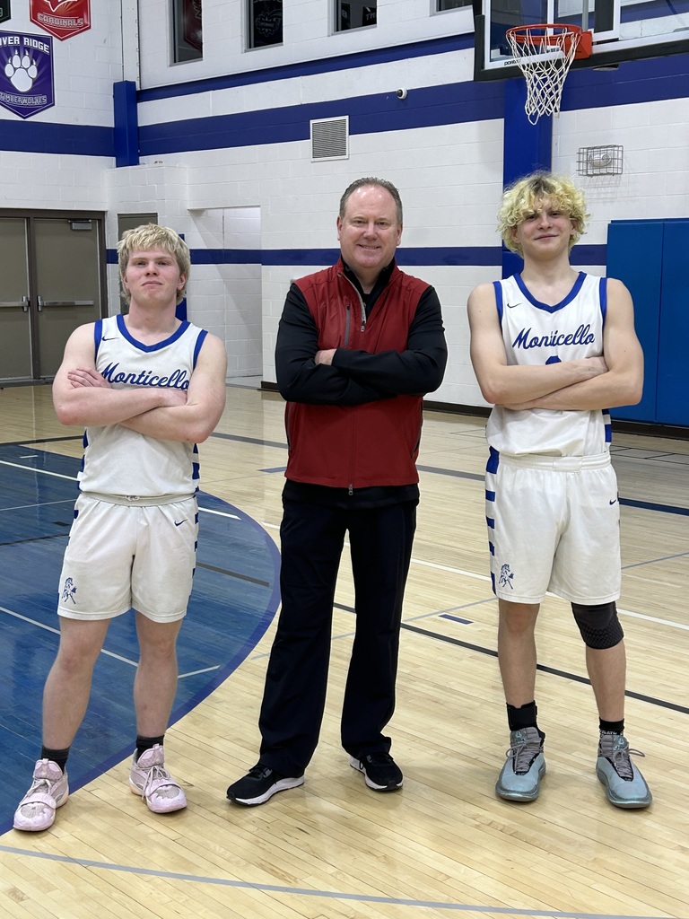 Senior Basketball Players and Badger Coach