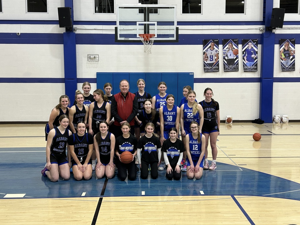 High School Girls Basketball Team and Badgers Coach