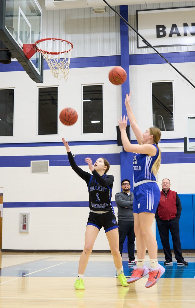 Girls Shooting Baskets