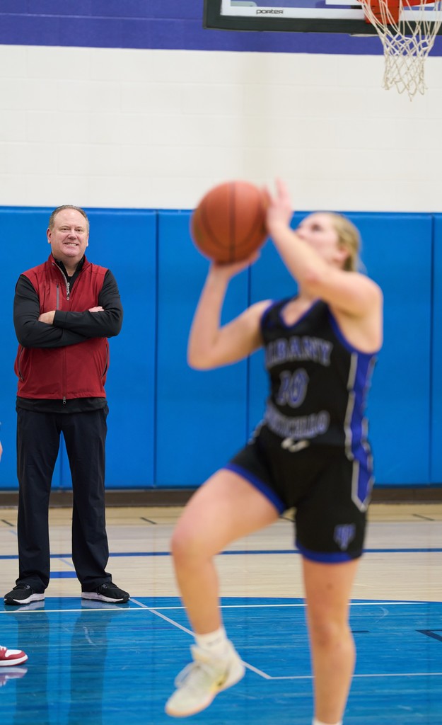 Coach and Girls Basketball Player