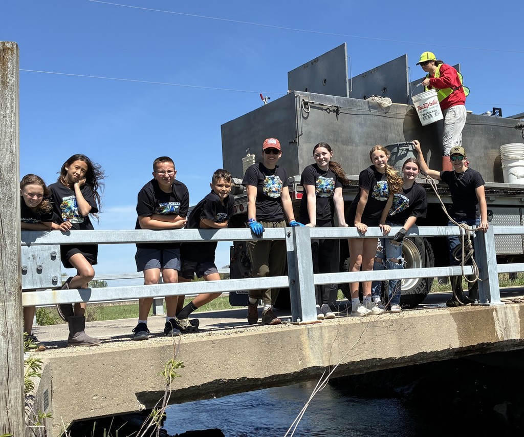 students and teacher on bridge