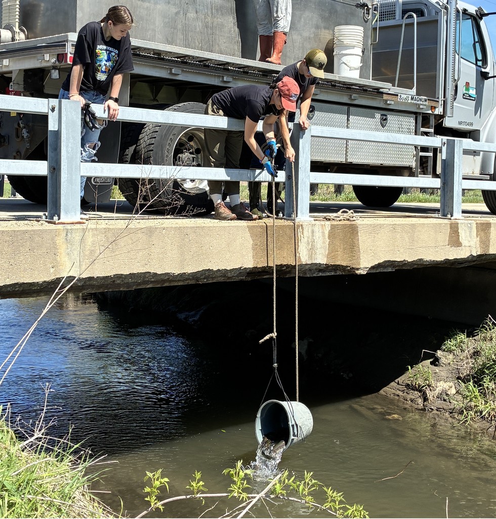 teacher and student restocking fish