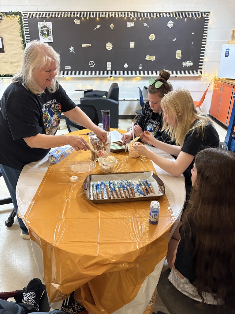teachers and students decorating pretzels