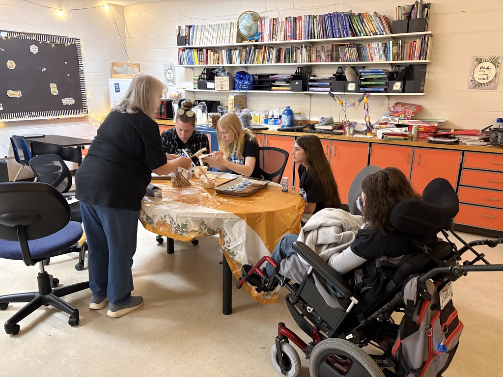 teachers and students decorating pretzels
