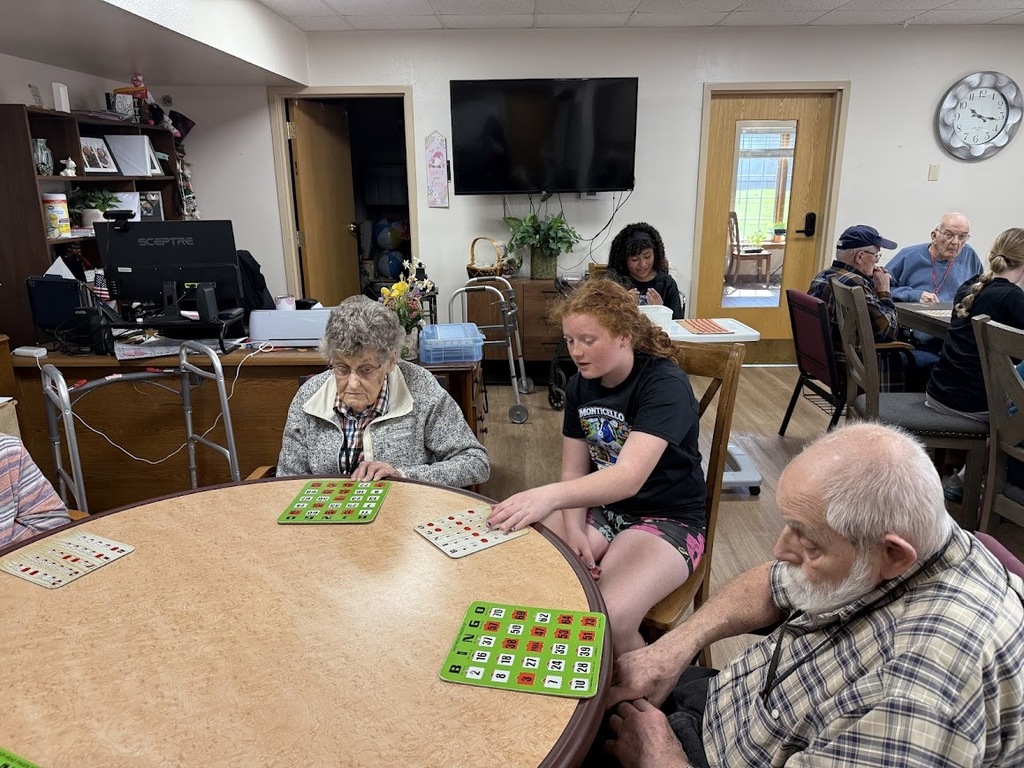 student and residents playing bingo