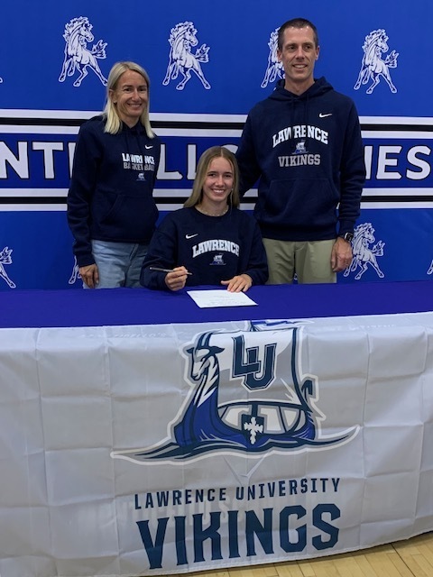 student athlete with parents