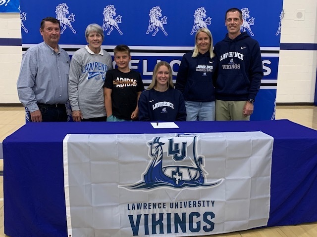student athletes with family