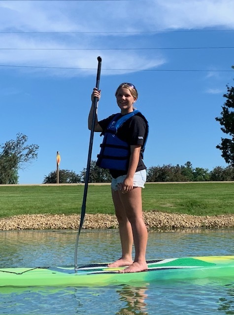 girl paddleboarding