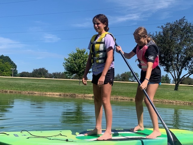 girls paddleboarding