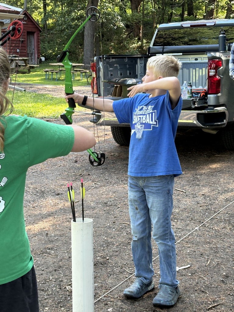 student shooting a bow