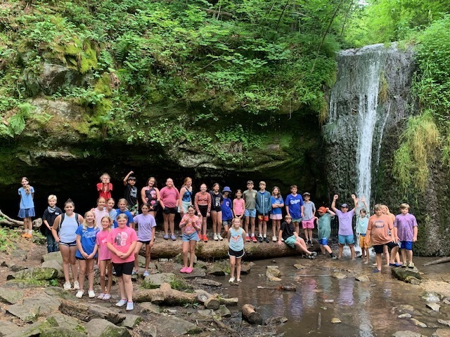 Middle school students by a waterfall in Governor Dodge State Park