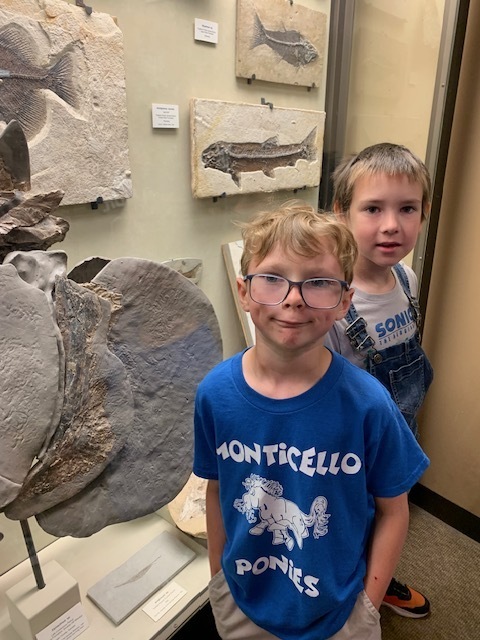 two students with fossils at University of Wisconsin -Madison's Geology museum