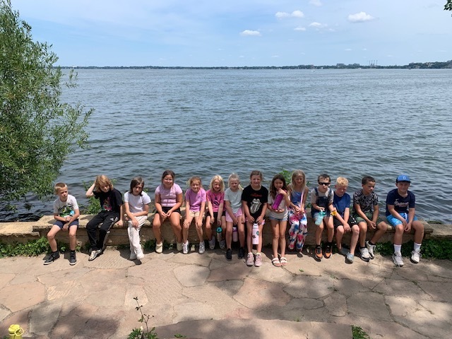 elementary students at a lake