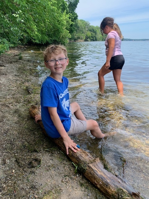 elementary students at a lake