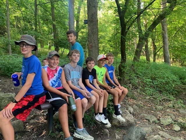 students sitting on a bench at High Cliff State Park