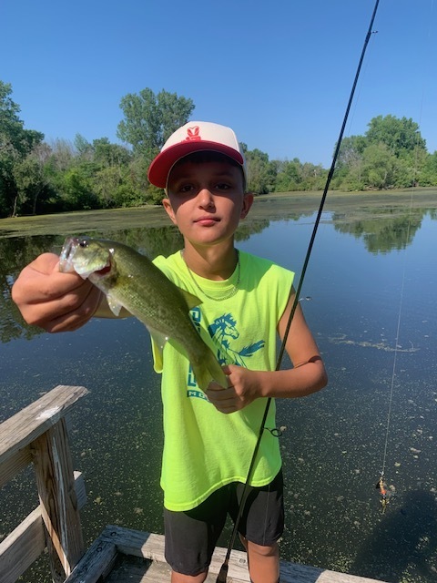 student holding a fish