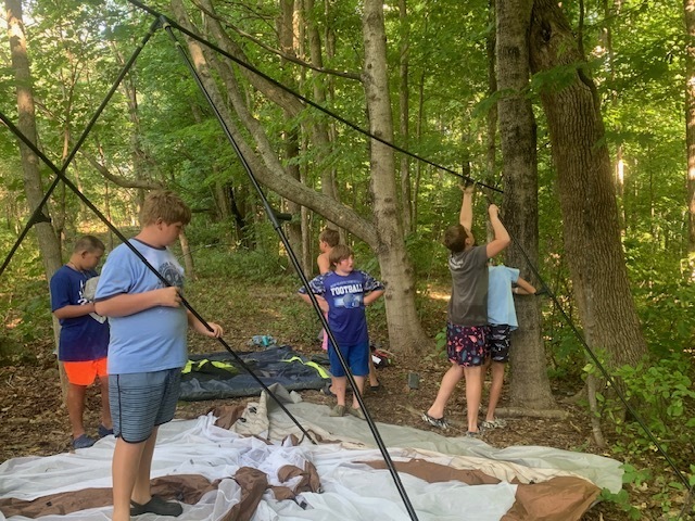 students putting tent up