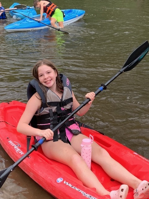 student kayaking
