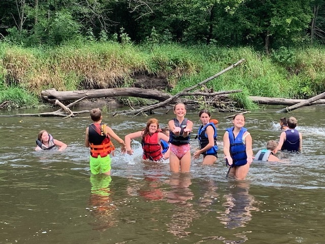 students playing in Sugar River