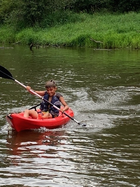 student kayaking