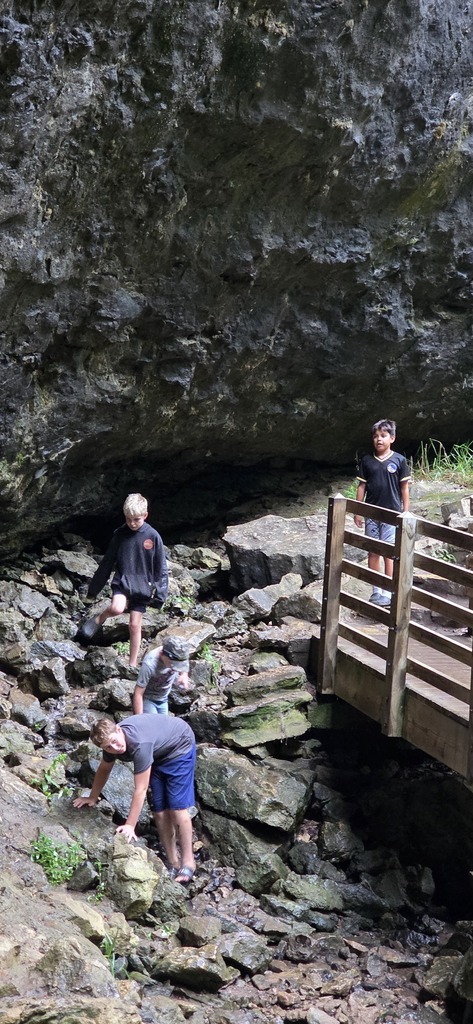 three students on a rocky climb