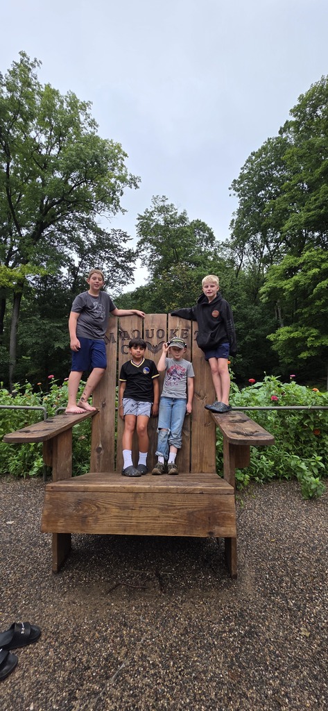 Four students on a big chair