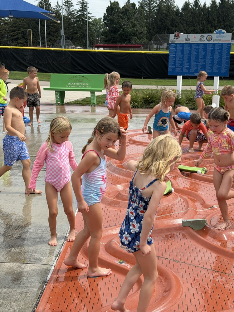 students at splash pad