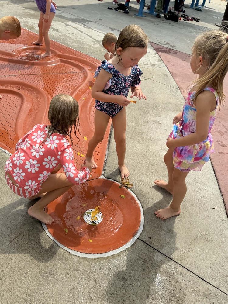students at splash pad