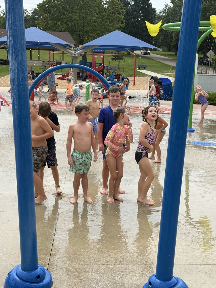 students at splash pad