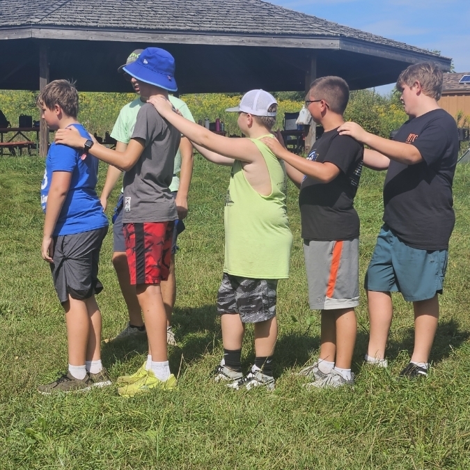 students practicing low ropes course