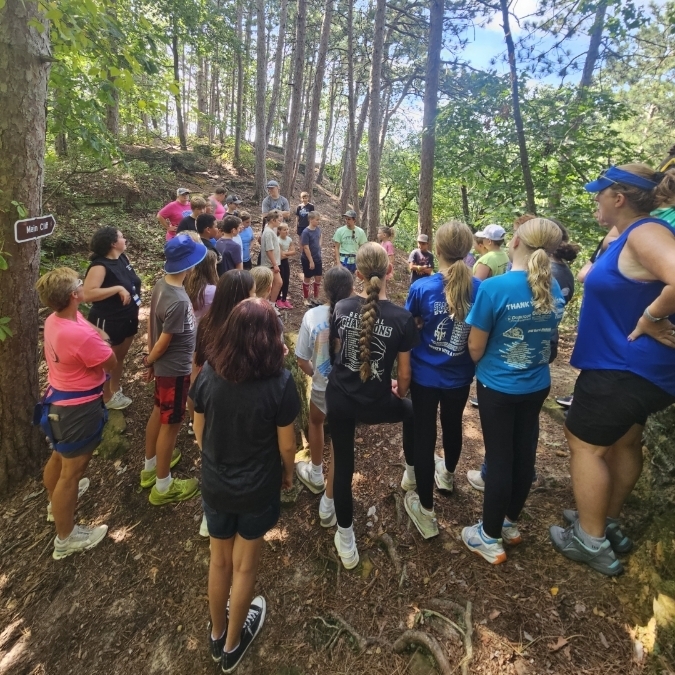 students and teachers on a hike