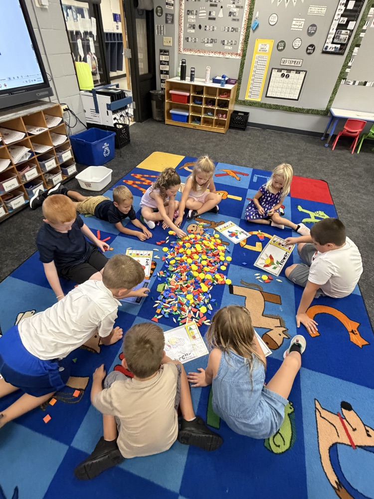 kindergartners on the floor playing math games