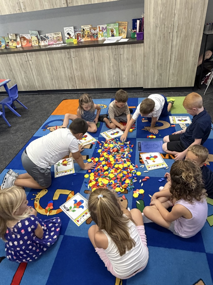 kindergartners on the floor playing math games
