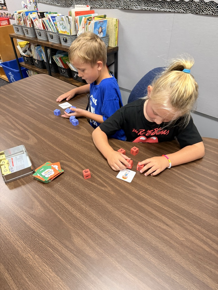 two first graders working hard