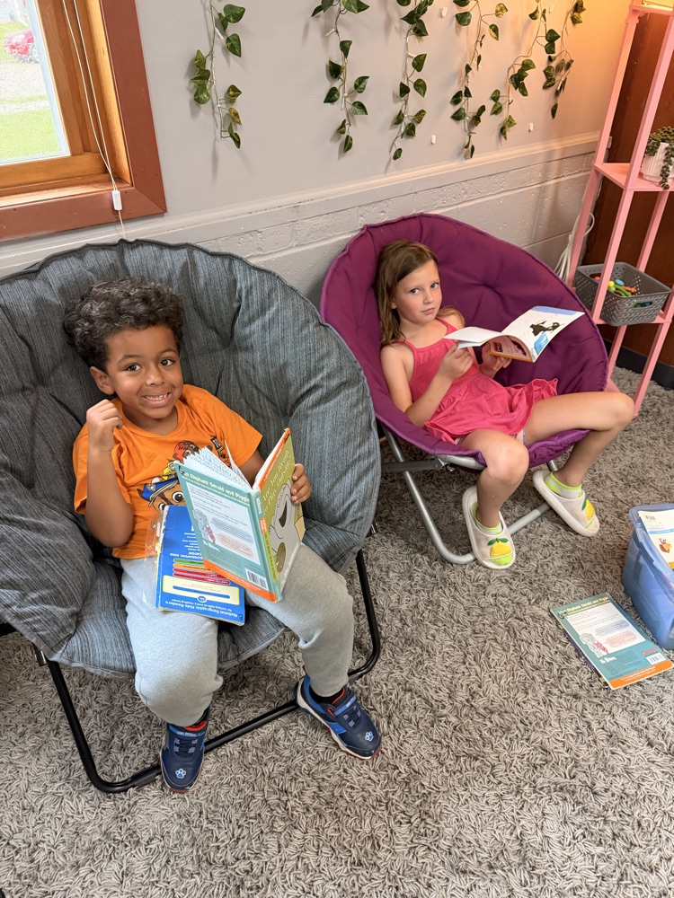 two first graders reading