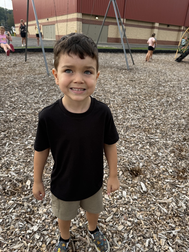 student smiling on playground