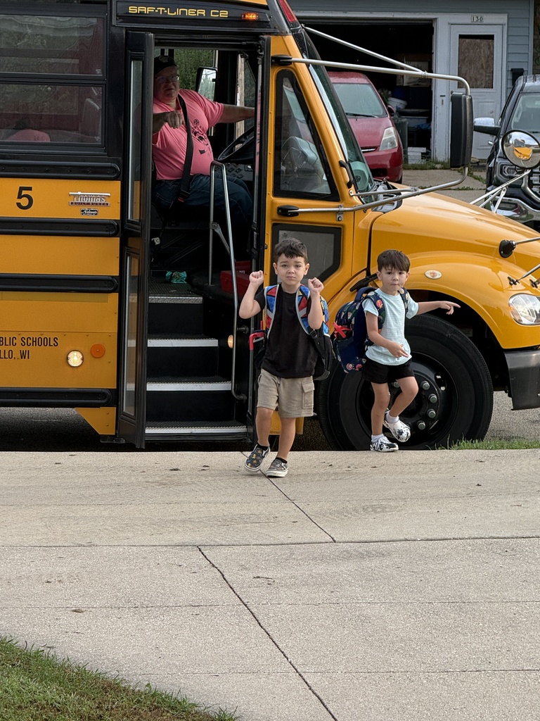 students getting off the bus