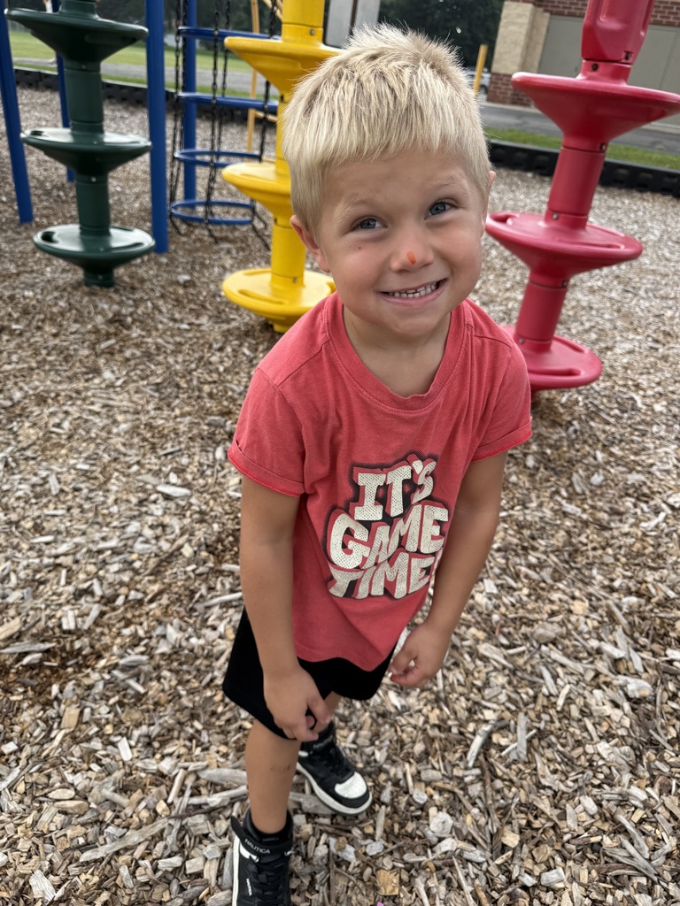 student smiling on playground 