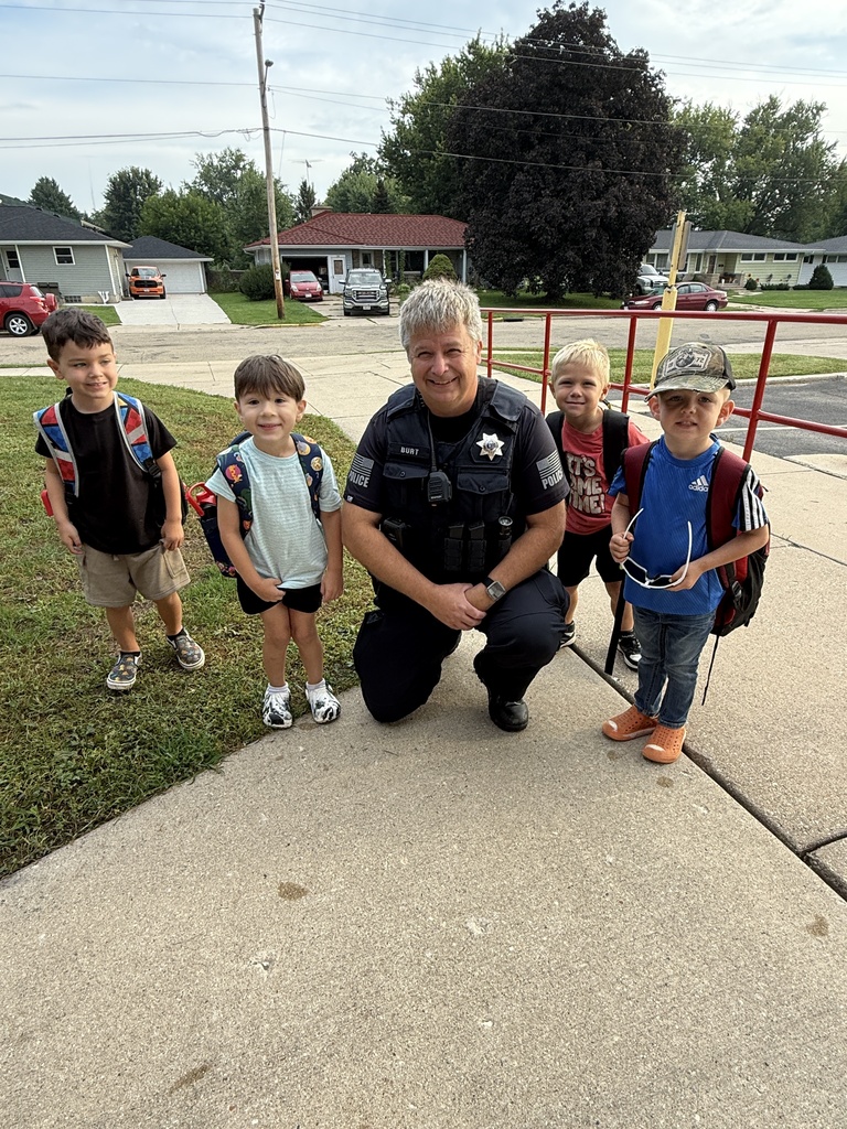 4K Students on the first day of school with the Monticello Officer