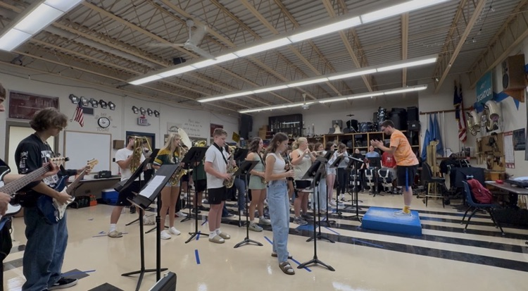 high school band students and teacher
