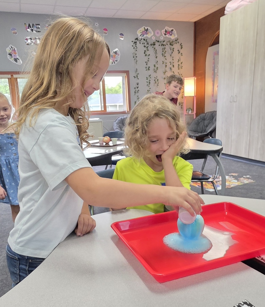 children doing a science experiment