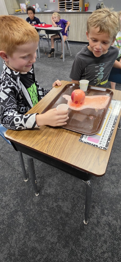 two students doing a science experiment