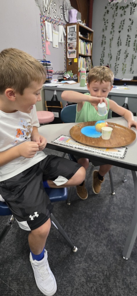 children doing a science experiment