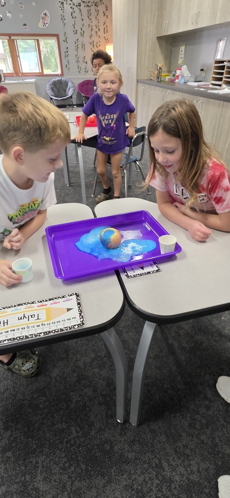 two students doing a science experiment