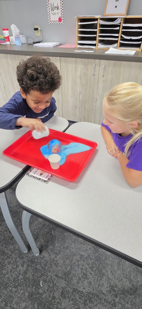 two students doing a science experiment