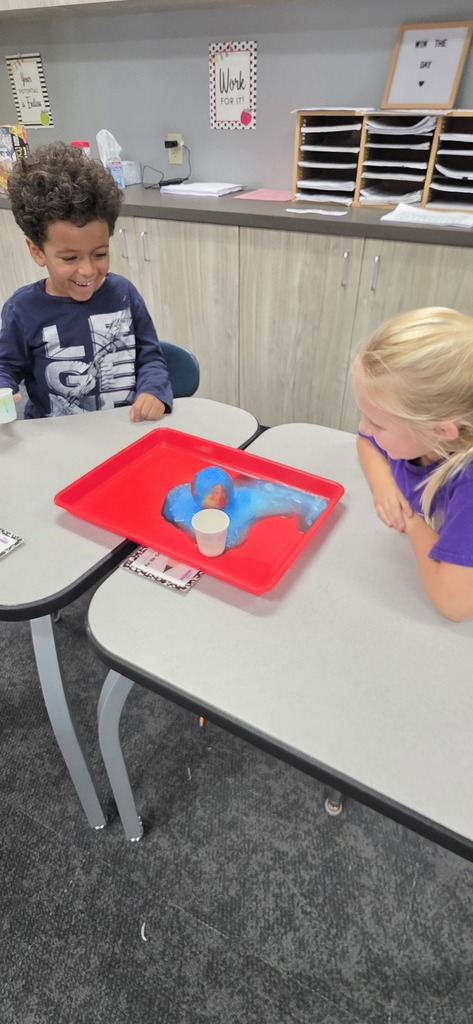 two students doing a science experiment 