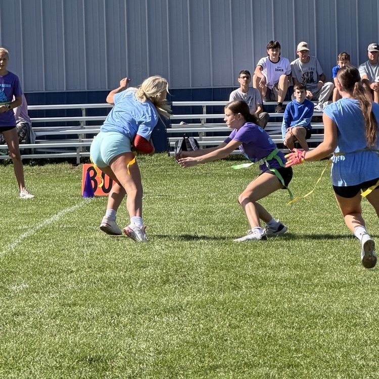 students playing football