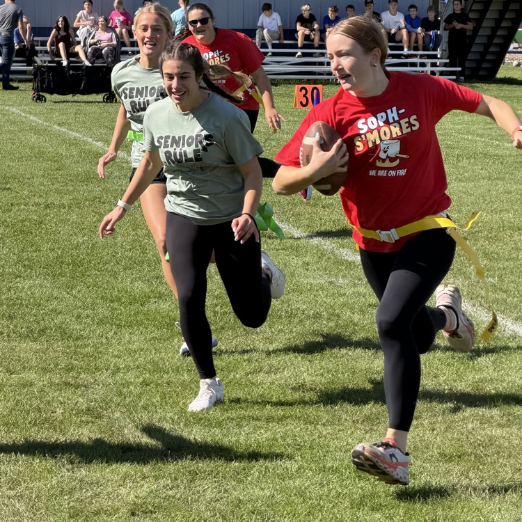 students playing football