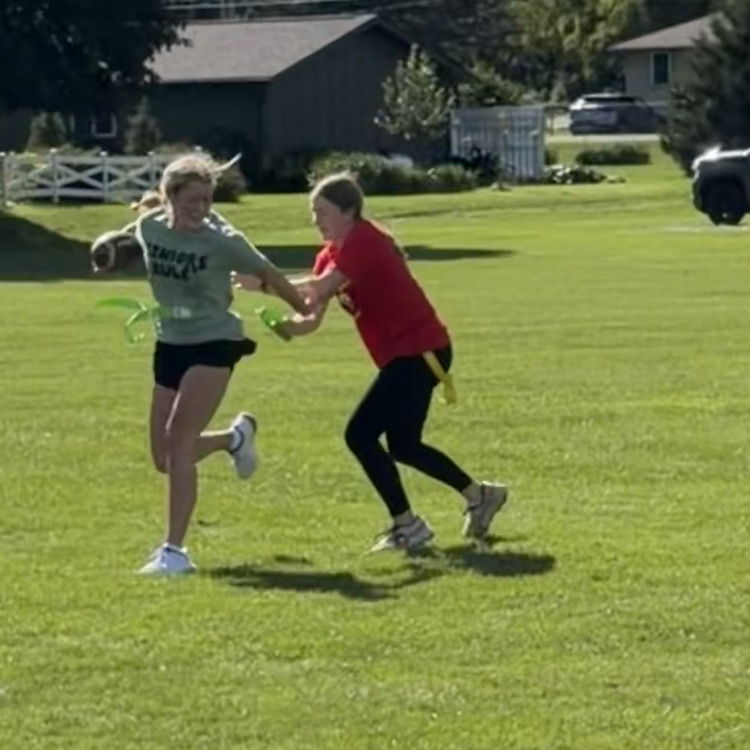 students playing football